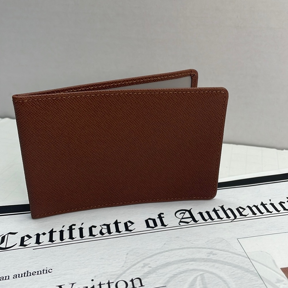 Authentic LOUIS VUITTON cognac brown TIAGA leather card case wallet with COA